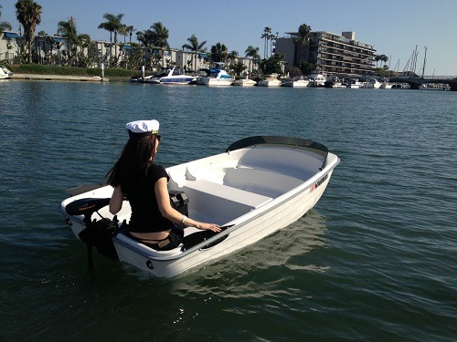 Woman in Sun Dolphin Water Tender Row Boat