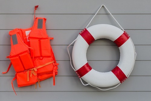 Life Jacket And Floatie On The Wall
